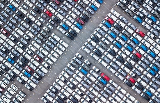 Cars as seen from above in parking lot